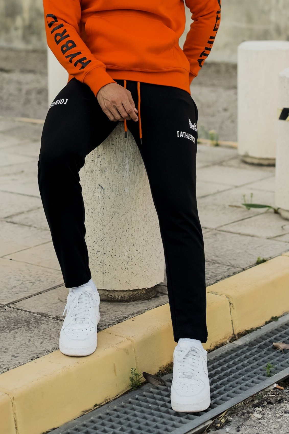 Orange and 2024 black tracksuit